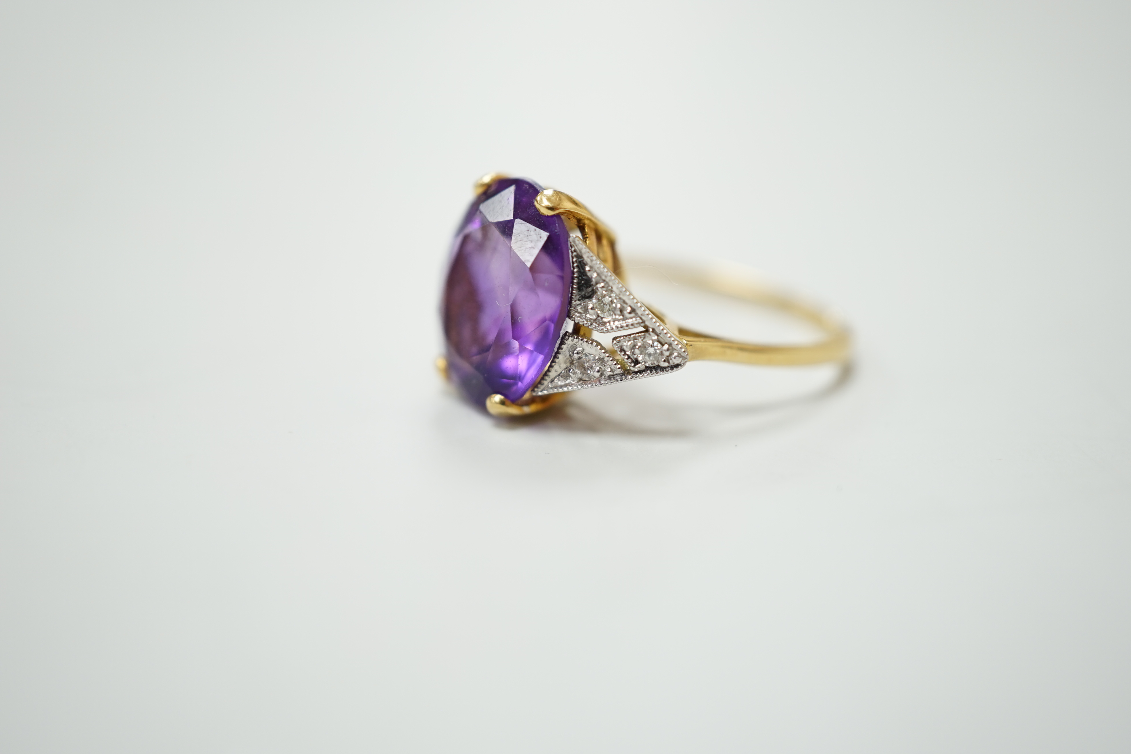 A 9K gold amethyst and diamond dress ring, size N
